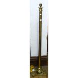 A brass standard lamp on platform base