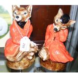 A Staffordshire fox and vixen dressed in hunting attire