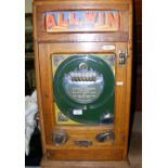An "All Win De-Luxe" coin in the slot amusement arcade pinball type machine