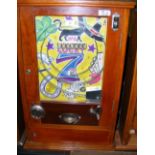 A 2p coin in the slot "Lucky 7" pinball type amusement arcade machine