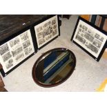 An oval antique wall mirror, together with a set of three engravings "Life on Board HM Training Ship