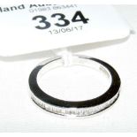 A diamond half hoop eternity ring in 18ct white gold setting