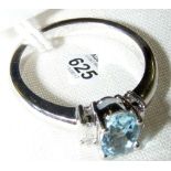 An 18ct white gold three stone aquamarine and diamond ring