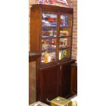 A mahogany glazed cupboard, together with a bookcase