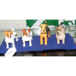 Four Beswick dog ornaments