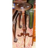 A mahogany torchere stand