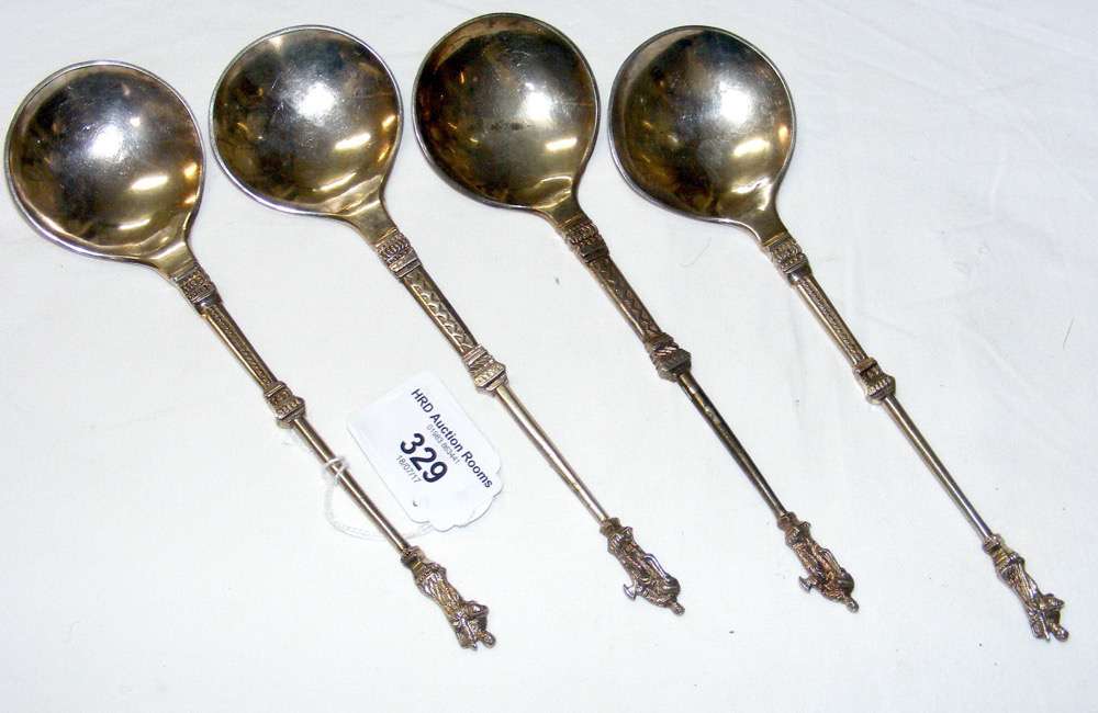 Four long silver Dutch apostle spoons