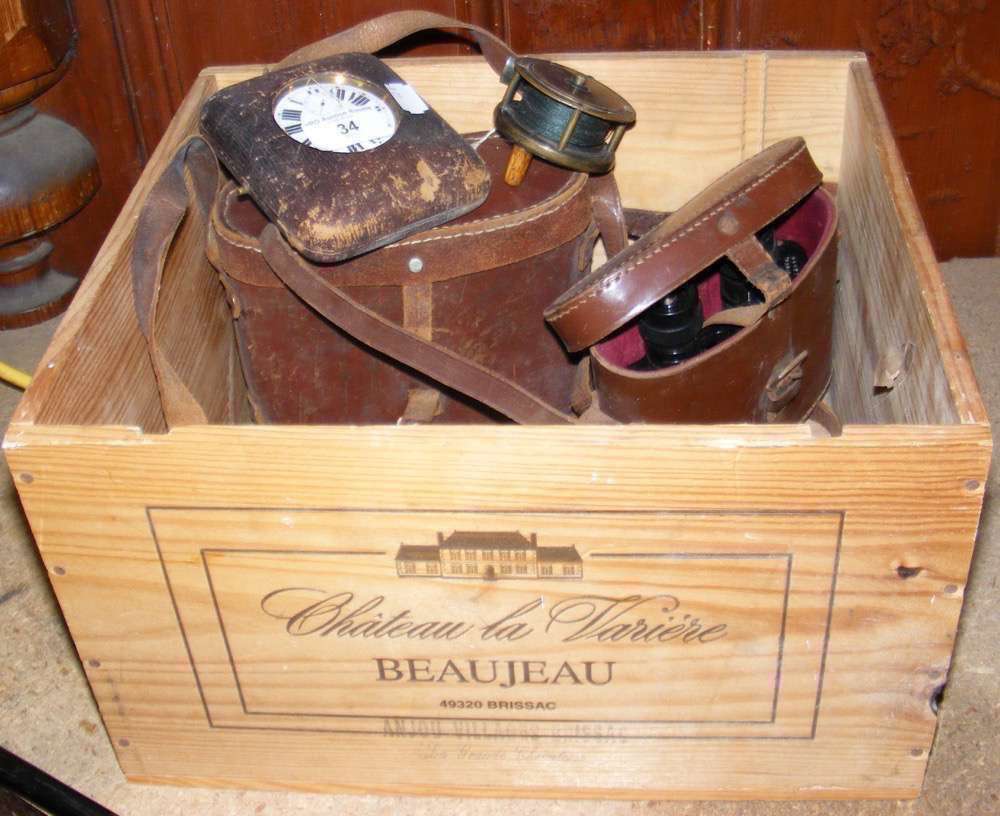 A travelling Goliath pocket watch, together with old fishing reel, binoculars, etc.