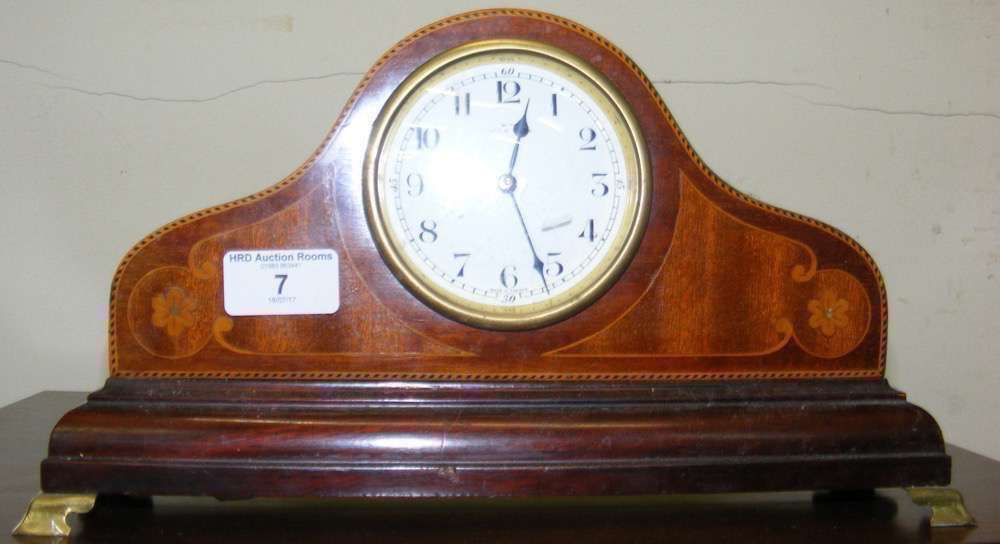 An Edwardian mantel clock with inlaid decoration