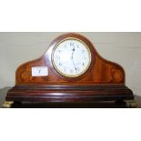 An Edwardian mantel clock with inlaid decoration