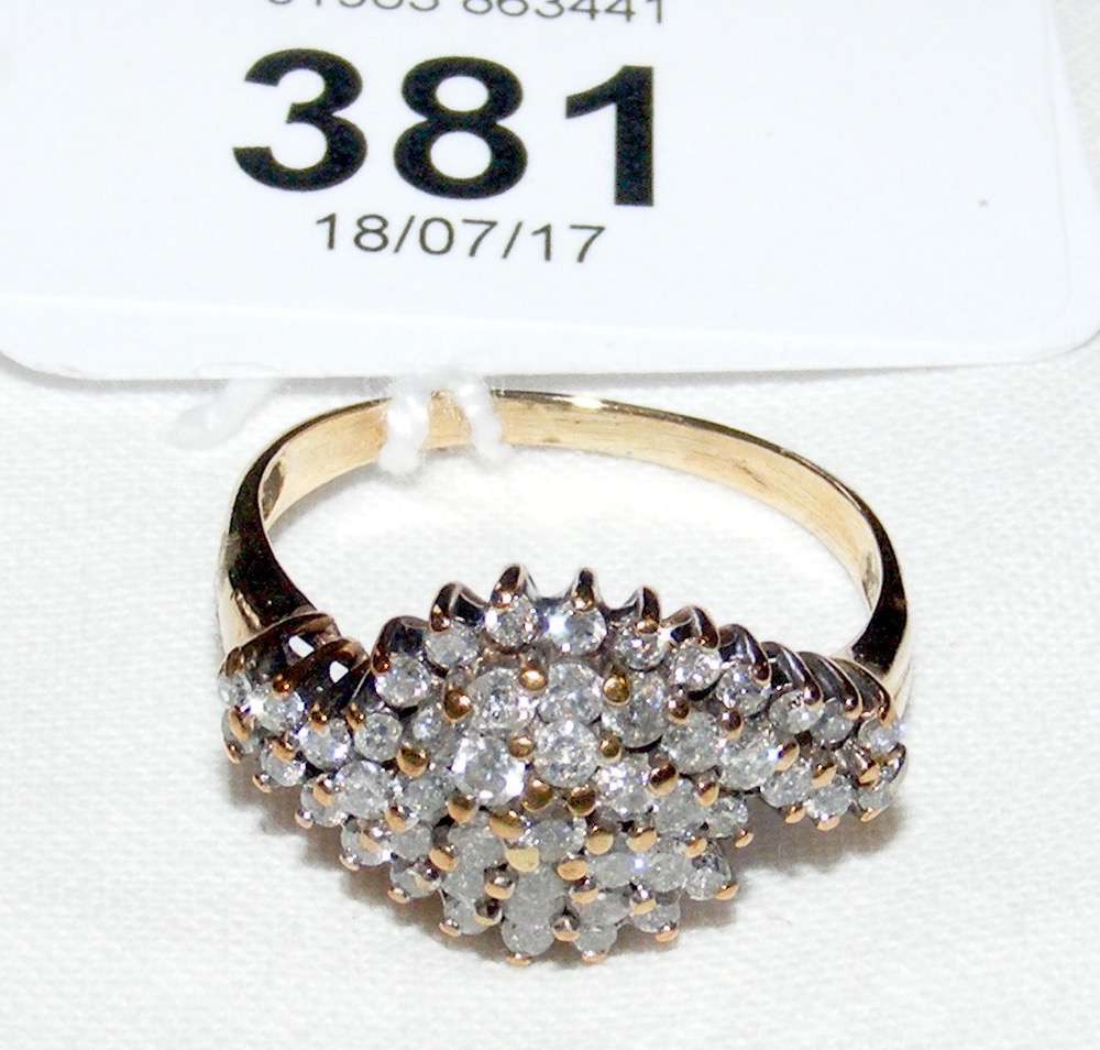 A diamond cluster ring in 9ct gold setting