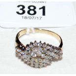 A diamond cluster ring in 9ct gold setting