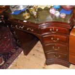 A lady's unusual mahogany writing desk with green leather top and nine drawers to the front - 108cm