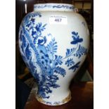 An 18th century Delft vase with blue floral decoration - 28cm high