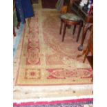 Large Wilton style carpet with red ground and floral border and centre medallion - 12ft x 9ft