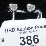 A pair of diamond heart shaped stud earrings (approx. 0.5 carat total) in 18ct gold setting
