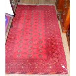 Antique Middle Eastern carpet with red ground - 210cm x 124cm