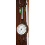 An oak wheel barometer/thermometer