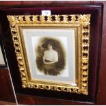 Fine quality gilt picture frame bearing monochrome photograph of lady mounted in glazed case -