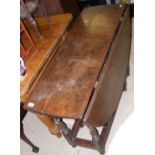 Period oak drop-leaf table on turned supports