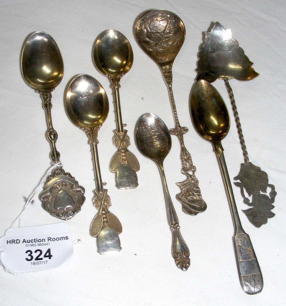 A pair of silver tennis trophy spoons, together with two other English silver and three foreign