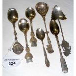 A pair of silver tennis trophy spoons, together with two other English silver and three foreign