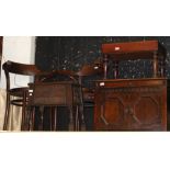 Two Bentwood armchairs, a carved oak worktable, oak cupboard, together with a commode