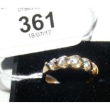 A five stone dress ring in gold setting