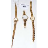 A lady's 9ct gold Tissot watch and strap, together with two other ladies' wrist watches