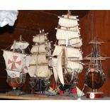 Four model wooden ships