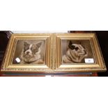 A pair of porcelain plaque dog portraits