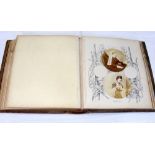 A Victorian photograph album with hand decoration