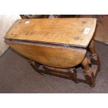 A small proportioned Ipswich style oak drop-leaf table - 58cm