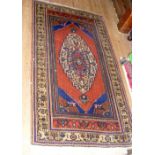 Middle Eastern rug with geometric border and centre medallion - 185cm x 100cm