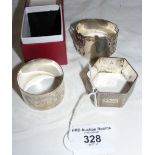 One boxed and two other silver napkin rings