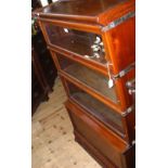 A Globe Wernicke sectional mahogany bookcase with drawer below - bearing London label - with key