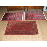 Three small Middle Eastern style rugs