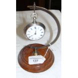 Silver pair cased pocket watch on stand