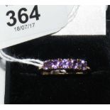 A 9ct gold amethyst five stone ring