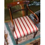 A Regency carver chair on turned supports
