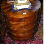 A half round antique style multi chest of drawers, standing on carved supports - 66cm