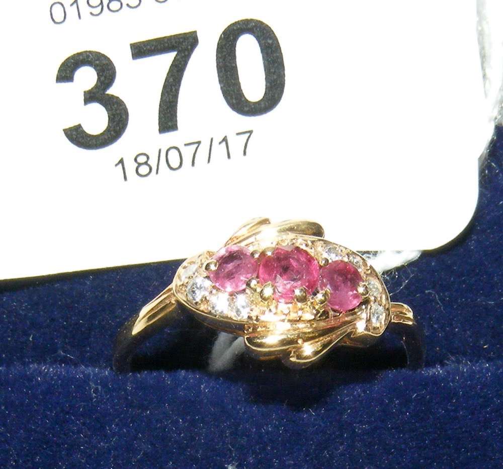 Ruby and diamond cluster ring in 9ct gold setting