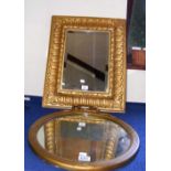 A decorative gilt mirror and one other