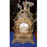 Decorative pierced brass mantel clock with porcelain plaque - 46cm high