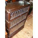 A Globe Wernicke three section bookcase with lead glazed front and drawer below