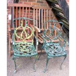 Pair of green metal garden chairs, together with two teak garden chairs