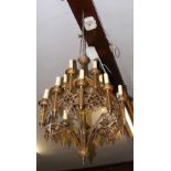 An old gilt metal Gothic style two tier chandelier - 80cm