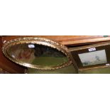 Small gilt oval wall mirror, together with a watercolour of windmill
