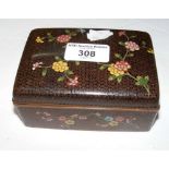 A decorative 12cm cloisonne box decorated with flowers