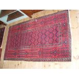 Middle Eastern rug with red ground - 178cm x 100cm